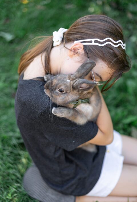 girl-plays-with-domestic-rabbit-street-pet-concept (1)